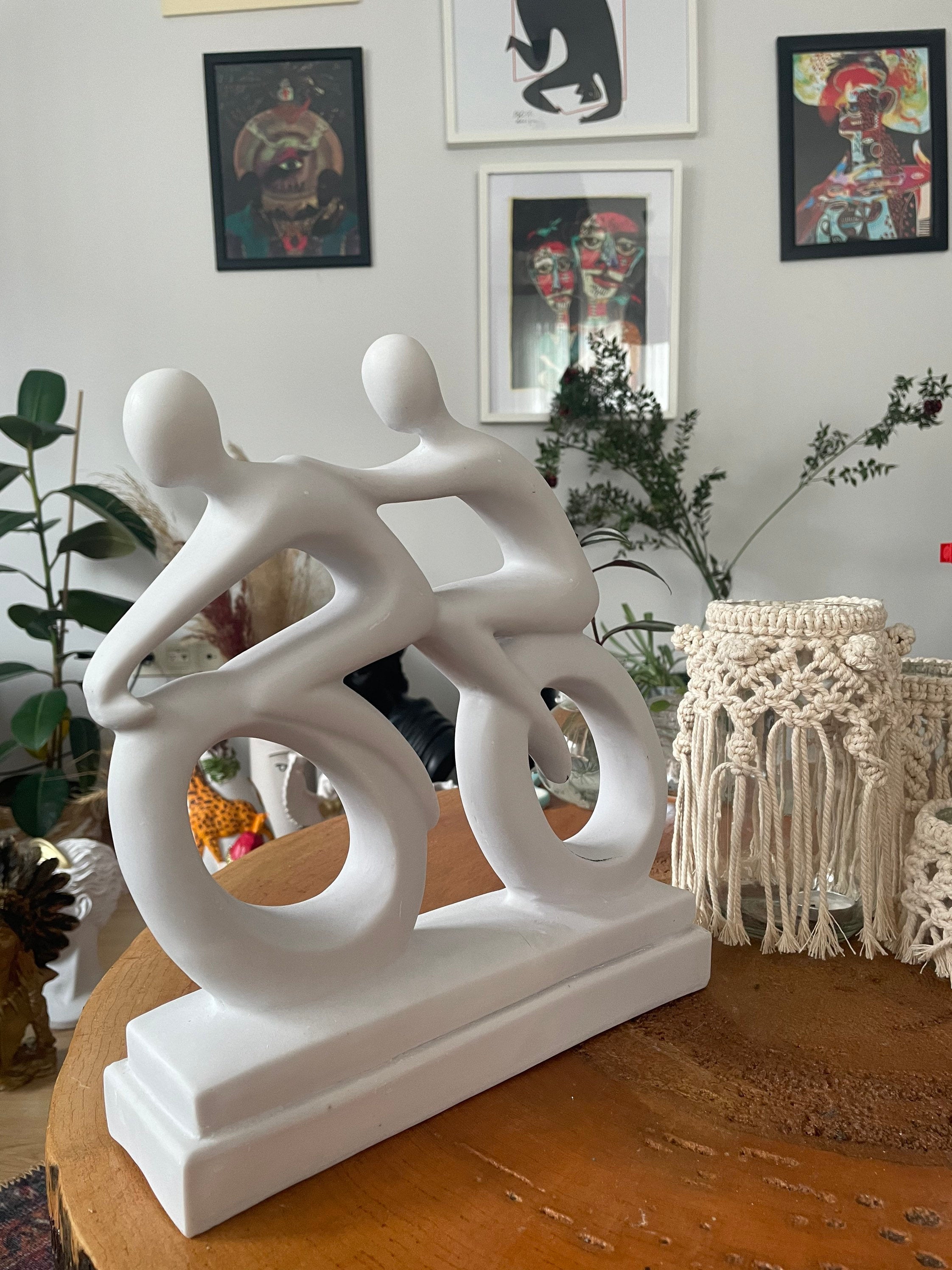 Abstract Cyclists Sculpture Statue: Capturing the Essence of Motion