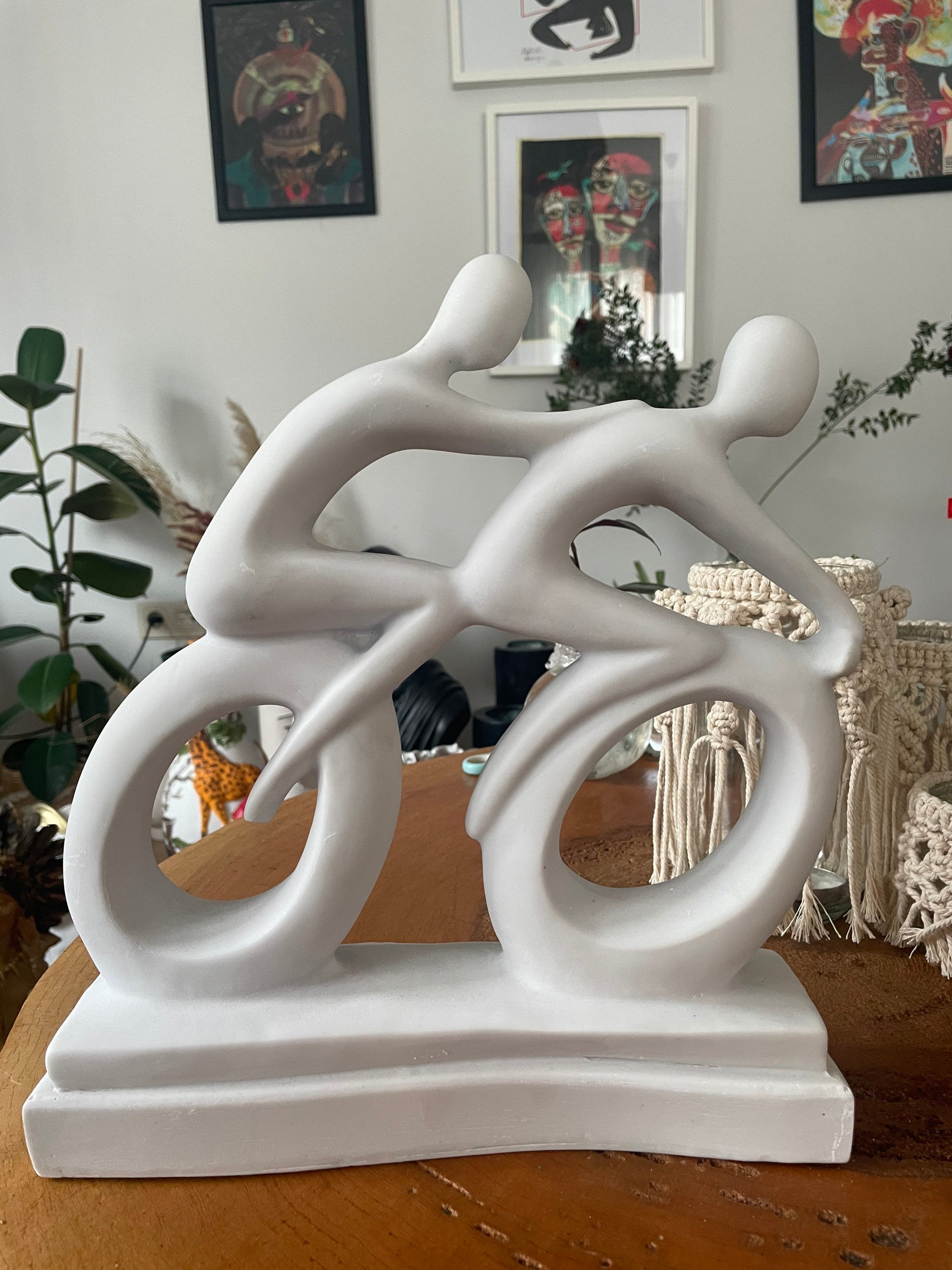 Abstract Cyclists Sculpture Statue: Capturing the Essence of Motion